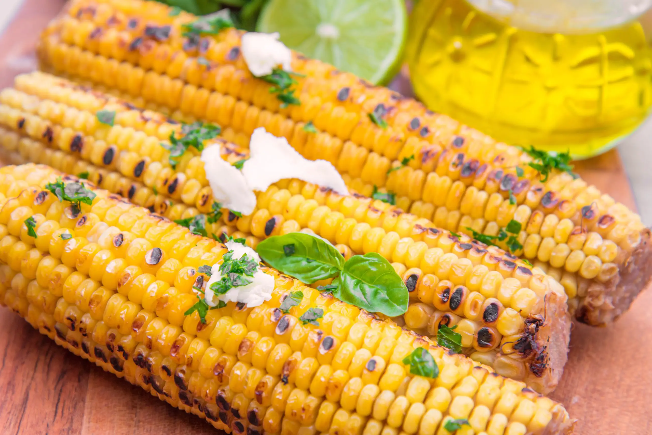 Grilled Corn with Coconut Lime Butter and Pepper Jack Cheese - Grill Girl